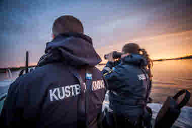 Coastguards in sunset